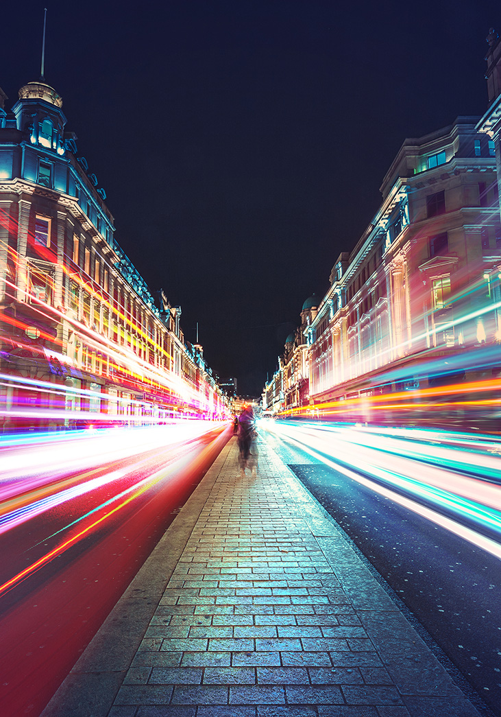 View of a night time city street with a long exposure